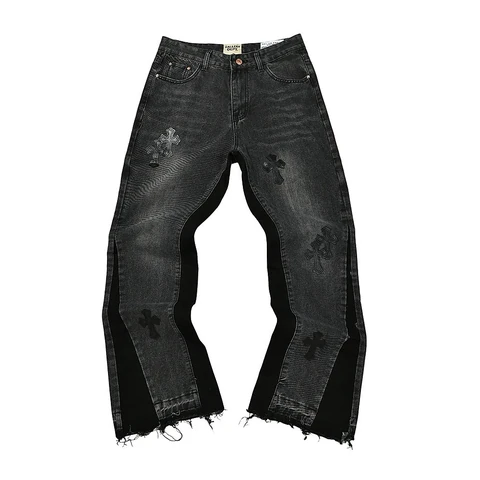 Black flared jeans with cross embroidery on a white background