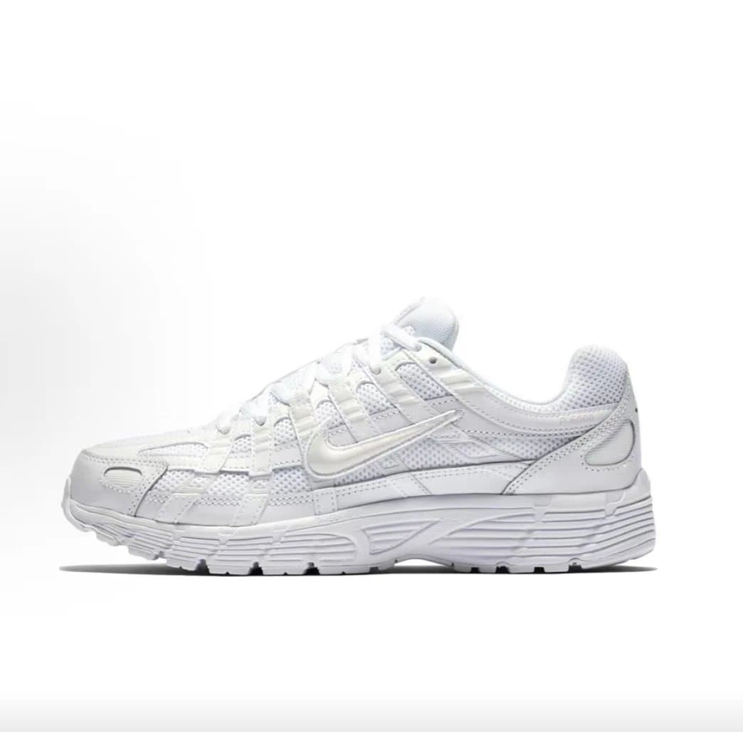 White mesh running shoe on a white background